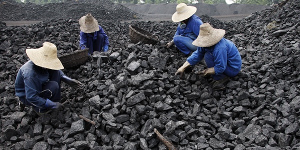 Chinese miners process coal from a mine